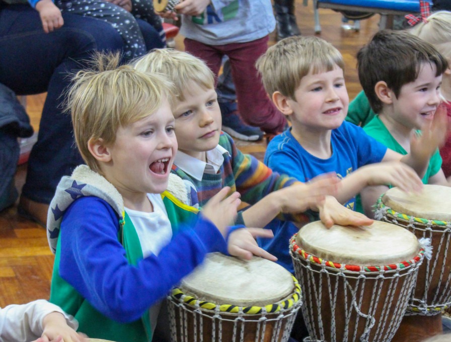 Children drumming in a Junior IMPs session