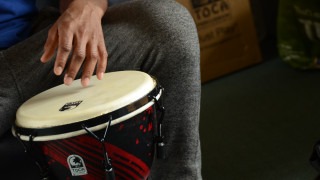 Playing percussion at Arts for Health project